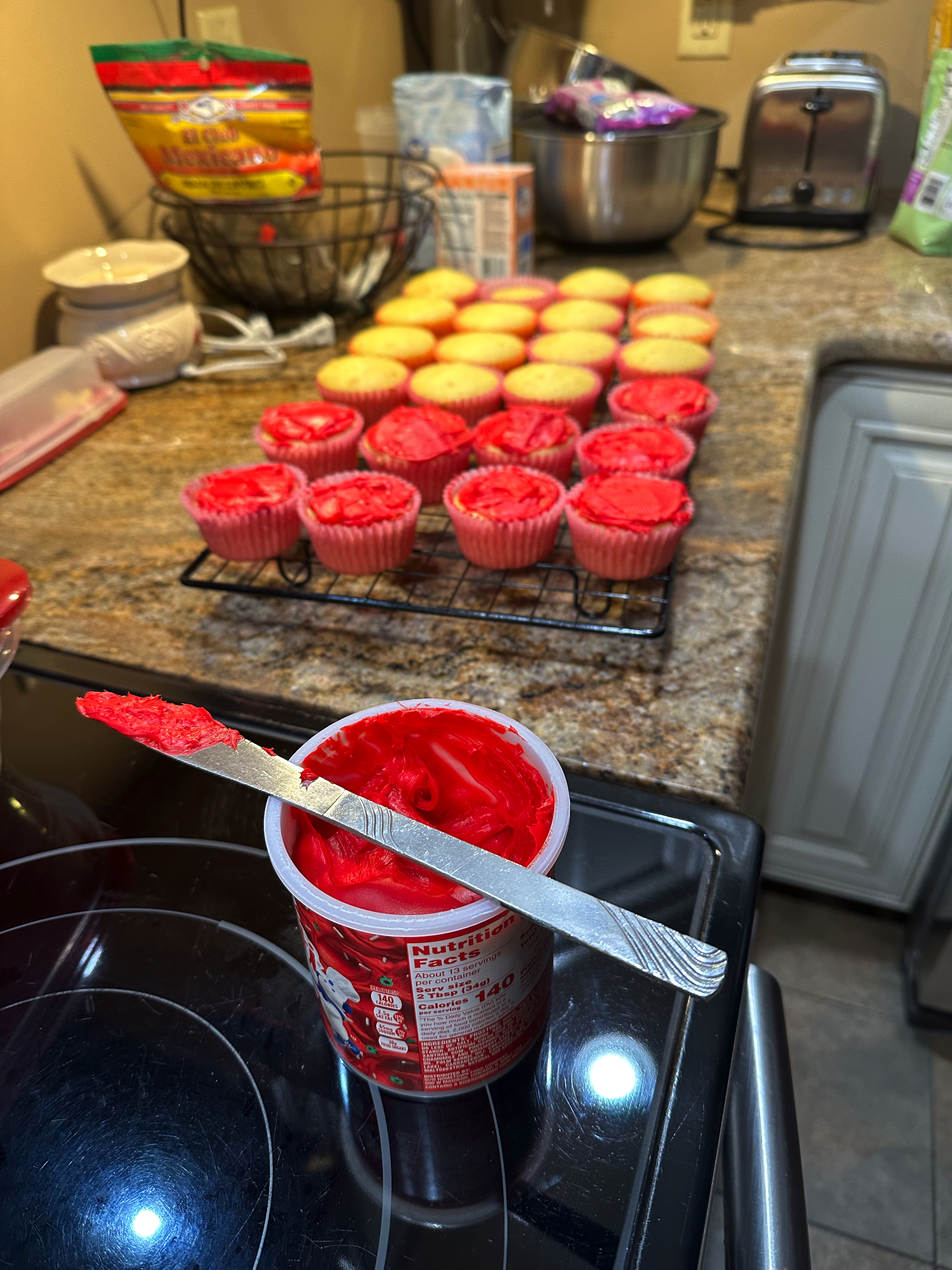 Vanilla Cupcakes with Icing and Holiday Sprinkles