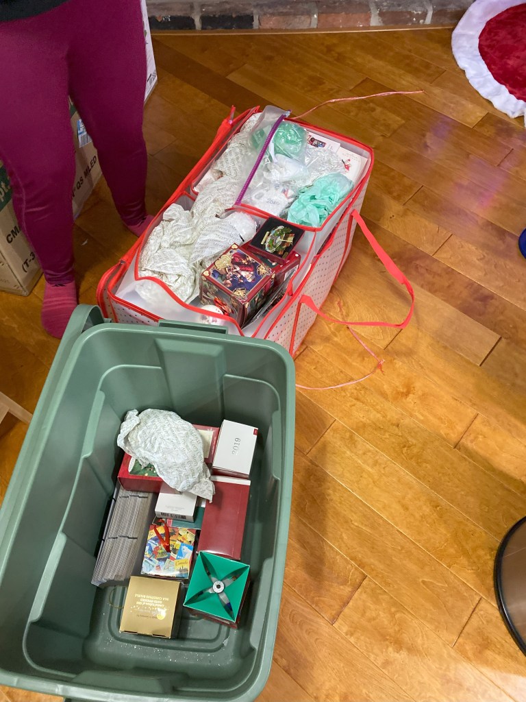 Two totes filled with holiday ornaments.