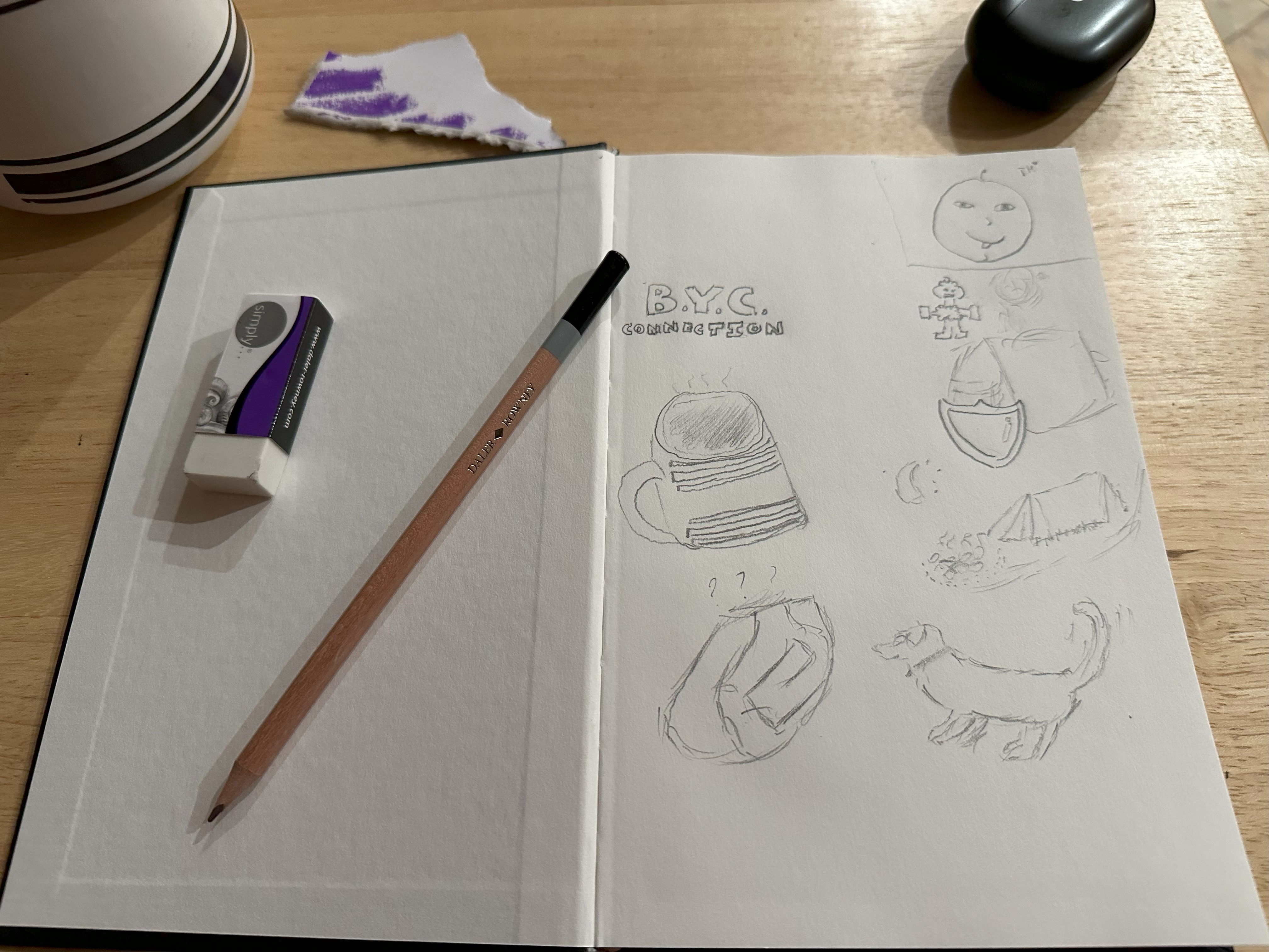 Open book full of small doodles.